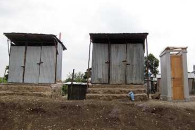 The Sanergy toilet, far right, next to existing toilets at Bridge International Academy school in the Lunga Lunga slum of Nairobi.