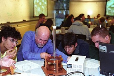 Professor John Belcher (second from left), one of the principal investigators for the Technology Enabled Active Learning (TEAL) Program, interacts with students in TEAL lab.