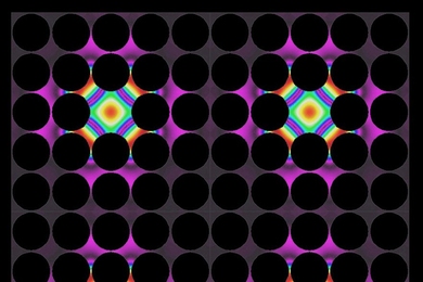Thermal lattices, shown here, are one possible application of the newly developed thermocrystals. In these structures, where precisely spaced air gaps (dark circles) control the flow of heat, thermal energy can be "pinned" in place by defects introduced into the structure (colored areas).
