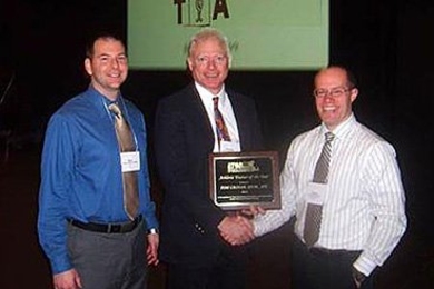 Tom Cronan (center) poses with MIT Athletic Trainer Scot Spak  and Thomas Dodge, president of the Athletic Trainers of Massachusetts.