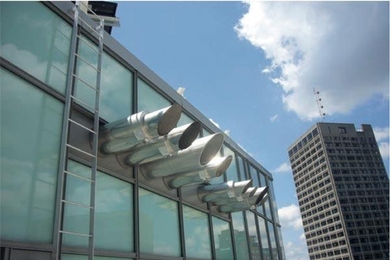 Performing the blower door test on the new Sloan building required first sealing up all external openings, including the kitchen fans shown here.