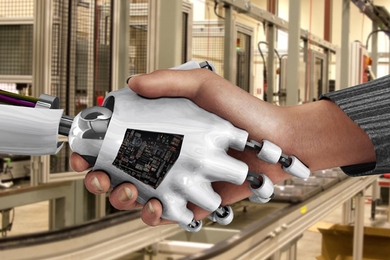 a robot hand and a human hand, shaking