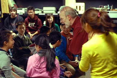 Edgerton instructor Ed Moriarty, center, is surrounded by students during a session.