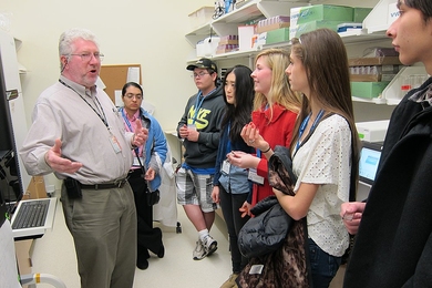 Richard Cook, a research scientist in the Koch Institute's Swanson Biotechnology Center, shows students around the Biopolymer and Proteomics Core Facility.