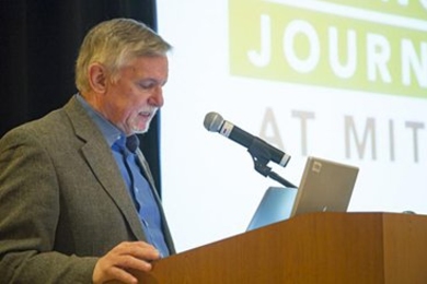 Philip Hilts, director of the Knight Science Journalism fellowship program, addresses a 30th anniversary celebration for the program.