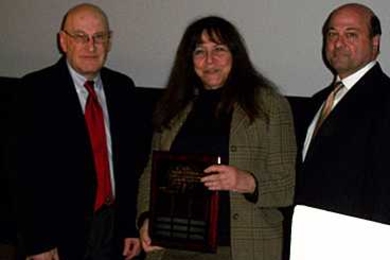 Professor Joseph Sussman (left) presented the Martore Award to Professor Nancy Leveson. Joseph Martore is at right.