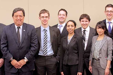 Energy Conference keynote speaker Bill Richardson, third from left, and MIT President L. Rafael Reif, right, pose with student organizers of the conference, including managing director Daniel Connell, second from left.
