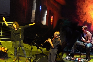 Three performers on stage