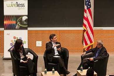FCC Chairman Julius Genachowski (center) speaks with Professor Dina Katabi and Professor Hari Balakrishnan during the event. 