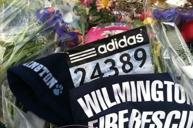 Charlotte Rocker MBA '11, SM '12 left her marathon number at the memorial site near the Stata Center.