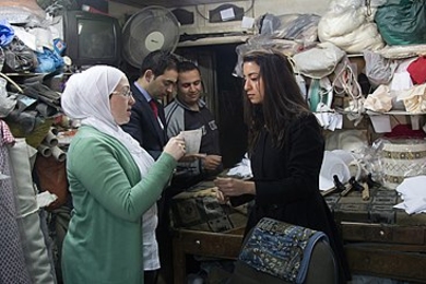 Hoda Eydgahi (right), a PhD candidate in electrical engineering and computer science, meets with a potential customer in Jordan.