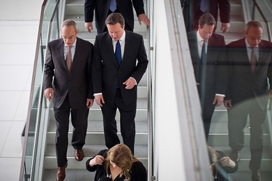 MIT President L. Rafael Reif (left) leads Prime Minister David Cameron on a lab tour.