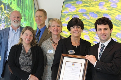 Awardee David Benjamin (right) with (from far left) advisor Richard O. Hynes, the Daniel K. Ludwig Professor for Cancer Research at MIT; Anne E. Deconinck, interim executive director of the Koch Institute; and Greg Safko, Susan Bancroft and Regina Bodnar of the Joanna M. Nicolay Melanoma Foundation
