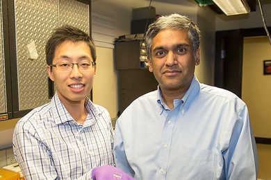 From left: Sungjae Ha and Anantha Chandrakasan demonstrate the chip in the Nanomechanics Laboratory.