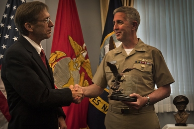 Assistant Secretary of the Navy Sean Stackley presents Adm. Thomas Eccles with the award last month.
