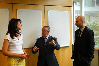 Massachusetts Secretary of Education Matthew Malone (center) speaks with Natalie Kuldell (left) &#8212; instructor in the Department of Biological Engineering and founder of BioBuilder &#8212; and Ryan Mudawar of Massachusetts Life Sciences Center.