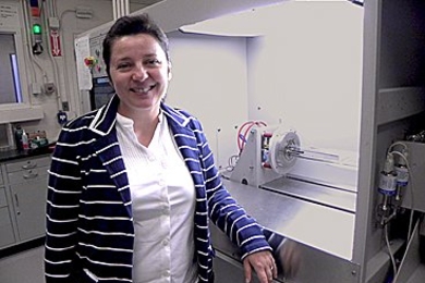 Associate Professor Silvija Grade&#269;ak with a metal organic chemical vapor deposition system used to create nanowires from metal seed particles. 