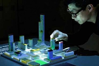 The CityScope tool uses an array of HD video projectors and 3D mapping to visualize a wide range of urban simulations, from flows of data to human behavior, by projecting them onto physical models.