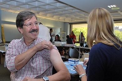 MIT Medical Senior Optician Roger Proulx received his annual vaccination.