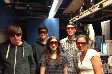 Lambda Project Lab Manager Jill Sewell (far right) with students (from left) Andrew James, Kenny Li, Alexa Beatrice, and Noah Gopen in the spectroscopy lab at MIT. 