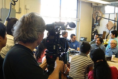 50 Eggs Films cinematographer Donald McIntosh films the conversation.