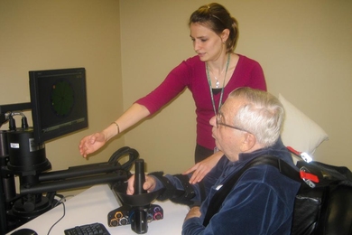 After suffering a stroke, a patient learns to operate the robot MIT-Manus to improve mobility.