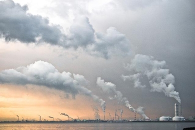 plumes from power plants against the sky