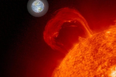 Photo illustration of the sun with a giant loop of gas (a sun flare) coming off of it