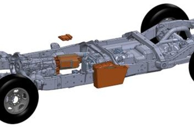 Shown here are XL Hybrids' electric powertrain components (in brown) that attach to traditional gas and oil powertrains. These components include the traction motor (nearest the front), the drive motor (on the side), and the lithium-ion battery (at the rear). 