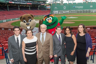 Don Rosenfield and his family pose at Fenway Park