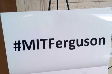 A sign that reads "#MITFerguson" 