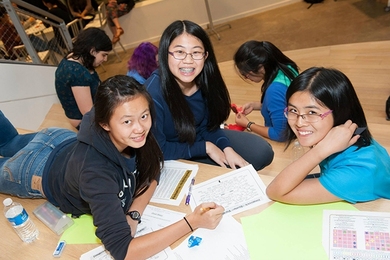 Math Prize participants work together on a puzzle hunt at Microsoft's game night.