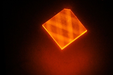 In this image, laser light enters a synthetic diamond from a facet at its corner and bounces around inside the diamond until its energy is exhausted. This excites "nitrogen vacancies" that can be used to measure magnetic fields.