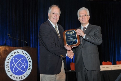 Richard Lester receives the American Nuclear Society Special Award from Steven Zinkle, chair of the ANS Honors and Awards Committee.