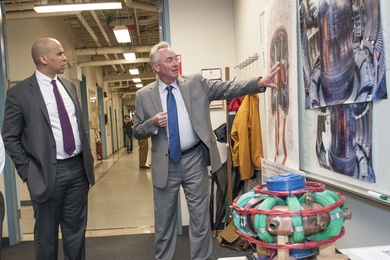Cory Booker, U.S. Senator from New Jersey, learns about new superconducting technology from Plasma Science and Fusion Center Director Dennis Whyte on a recent visit to MIT.