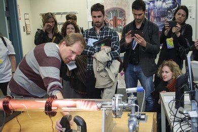 Bob Mumgaard of MIT demonstrates how the plasma in a glow discharge tube responds to magnetic fields.