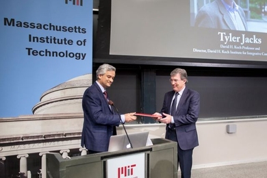 Krishna Rajagopal, chair of the faculty and professor of physics, presents Tyler Jacks with the Killian Award.
