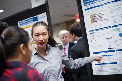 Course 6 junior Ashley Wang presents her project, “Visualizing Big Data in Mobile Application Development,” at the SuperUROP Research Preview in December. 
