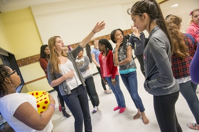 MIT junior Emily Benz instructs a group of SHINE participants.