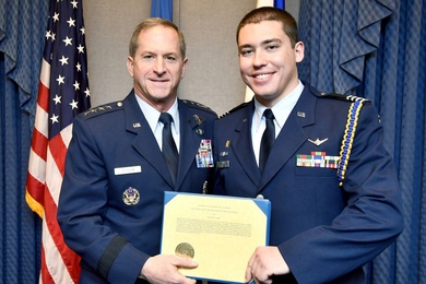 Air Force Chief of Staff Gen. David L. Goldfein (left) presents MIT Air Force ROTC Cadet Martin York the Cadet of the Year award in a Dec. 12 ceremony at the Pentagon.
