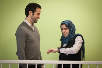 PhD candidate Mohammad Ghassemi (left) and graduate student Tuka Alhanai's system can detect the tone of a conversation using a wearable device.