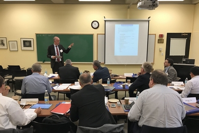 Martin Schneider, chief executive of the German Cement Works Association and head of the Verein Deutscher Zementwerke e.V. (VDZ) Research Institute, presents during a meeting that brought leaders of cement and concrete industry organizations together at MIT.  