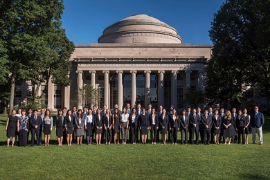 2017 MIT supply chain management graduates pose in front of the MIT dome.
