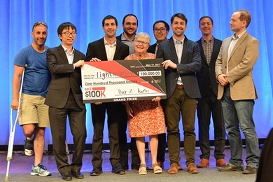 The winning team Lightmatter pose with organizers and friends.