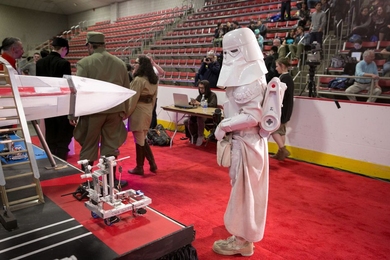 An Imperial Snowtrooper inspects a competitor’s entry at the 2017 MIT Mechanical Engineering 2.007 Student Design Final Robot Competition.
