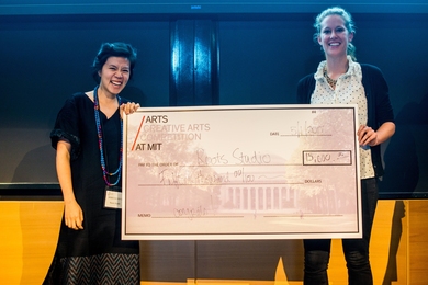 Roots Studio team members Rebecca Hui (left) and Macauley Kenney recieve the top prize in the 2017 Creative Arts Competition.