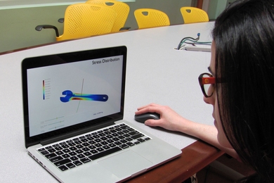 Adriana Schulz, an MIT PhD student in the Computer Science and Artificial Intelligence Laboratory, demonstrates the InstantCAD computer-aided-design-optimizing interface.