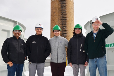 The Varanasi research group visits the MIT Central Utilities Plant cooling towers, where they will test their water-recapture technology with support from the new Campus Sustainability Incubator Fund. 