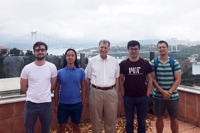 Members of the Buyukozturk group pose on the skydeck of the Engineering Building of Bogazici University, in Istanbul. Left to right: Murat Uzun, Justin Chen, MIT Professor Oral Buyukozturk, Hao Sun, and Steven Palkovic. The group traveled to Turkey to present their research as part of a collaborative workshop.