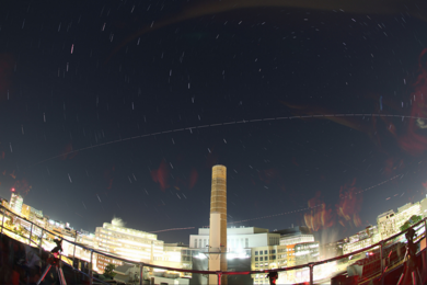 The path of the International Space Station can be seen from the Observe@MIT rooftop observing platform on Building 37. Participants in the second annual MIT Astronomy Training Camp took to the roof for pointers on night sky observing.